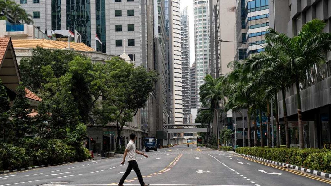 Singapore cuts stay-home period by a week