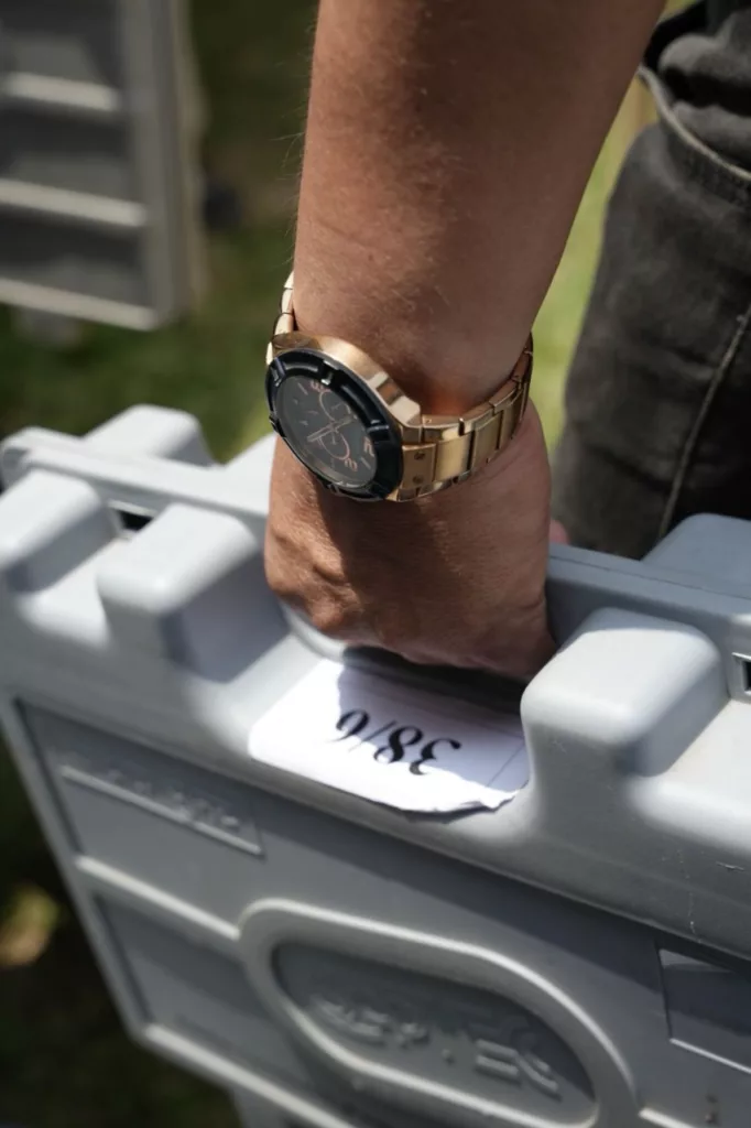 Indian election official carrying an EVM