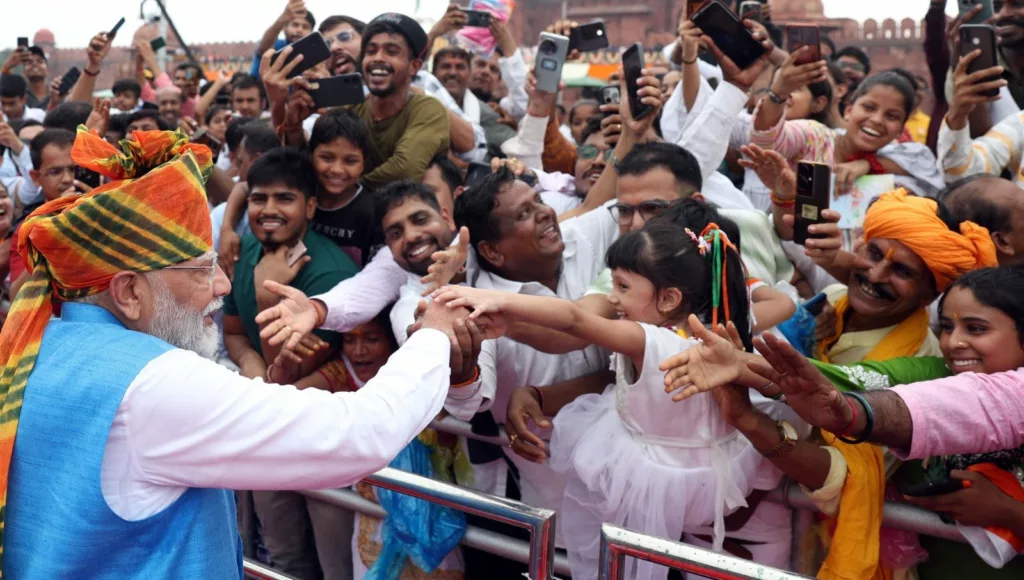 Narendra Modi greets the public at Red Fort\