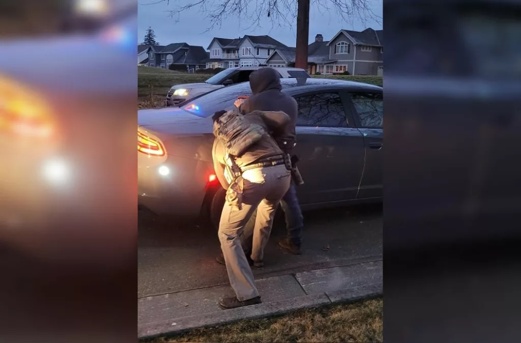ICE officials arresting one of the four individuals. Photo courtesy: www.ice.gov