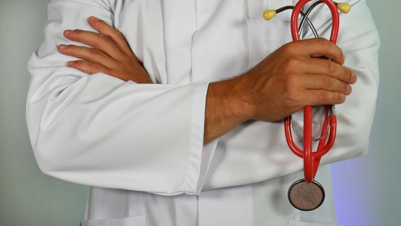 A doctor charged with distributing drugs without legitimate medical purpose to his patients in exchange for sexual favours