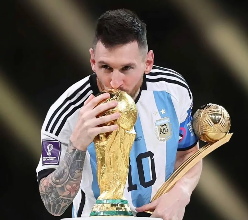 Argentina football captain Lionel Messi with the FIFA World Cup 2022 trophy